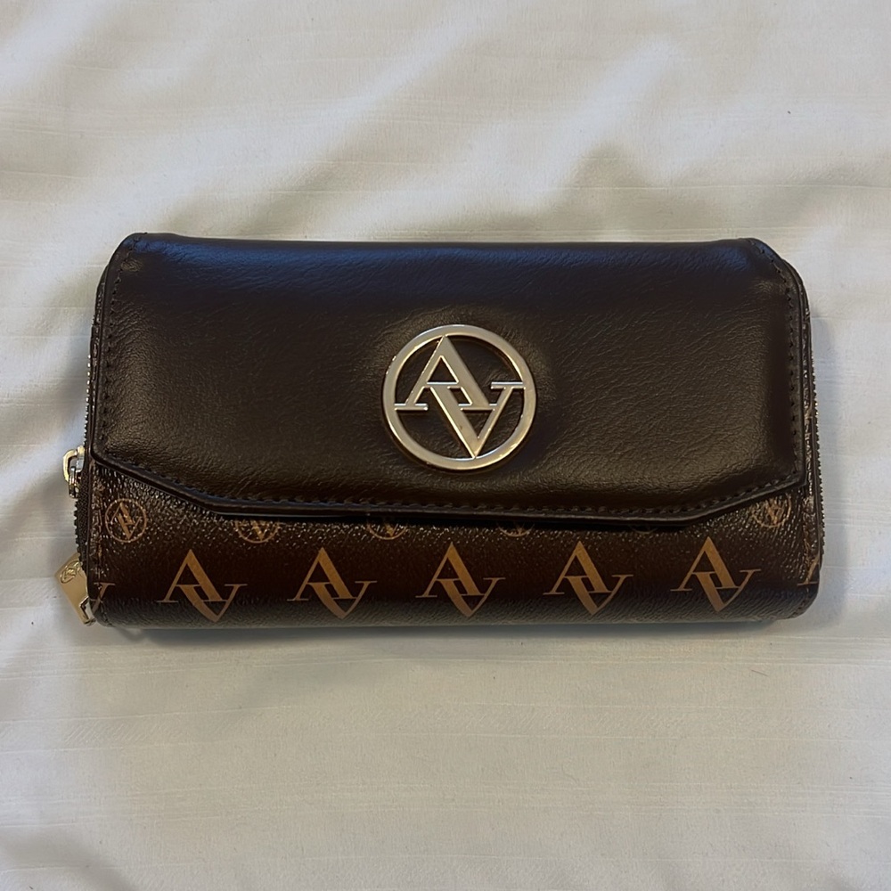Dark brown double zipper wallet and a pocket in the front